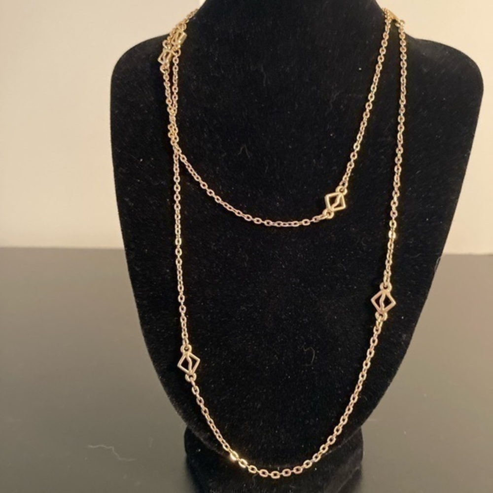 Golden necklace 16” has pretty dainty details.